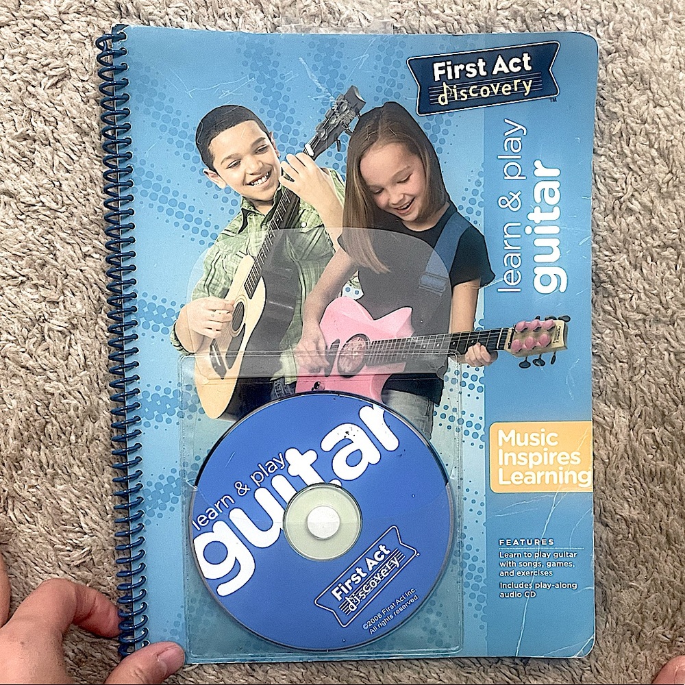 Learn and play guitar with CD- good condition. 31 pages